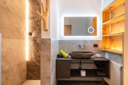 a bathroom with a sink and a shower at Weirerhof Lebm Gspiarn in Barbiano