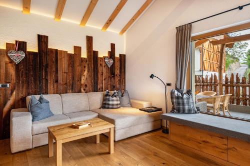 a living room with a couch and a table at Weirerhof Lebm Gspiarn in Barbiano
