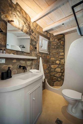 a bathroom with a sink and a toilet at Villa Vagia in Vayiá