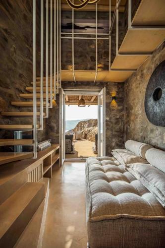 a room with a couch and stairs with a view at Villa Vagia in Vayiá