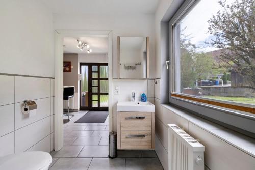 a bathroom with a sink and a window at Ruhig Wohnen in Sulz in Sulz am Neckar