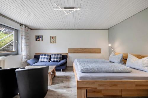 a living room with two beds and a couch at Ruhig Wohnen in Sulz in Sulz am Neckar
