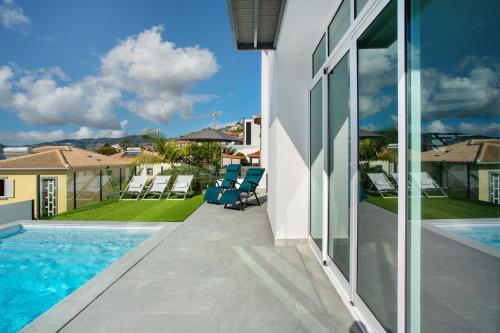 a view of a house with a swimming pool at Pico Do Paraíso in Funchal