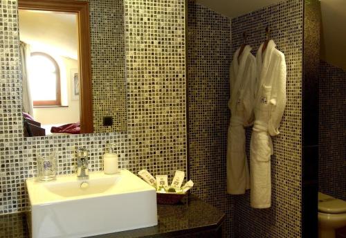 a bathroom with a sink and a mirror at luxury stone villa in Girona