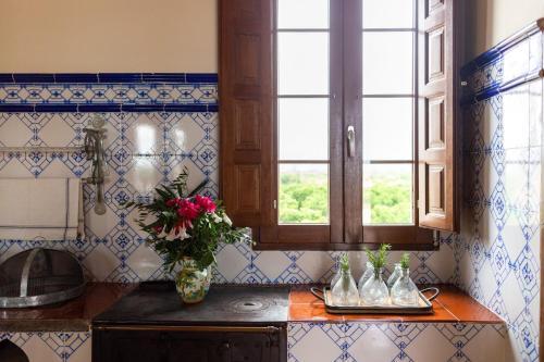 a kitchen with a vase of flowers on a counter at Villa Monsalva in Monte San Miguel