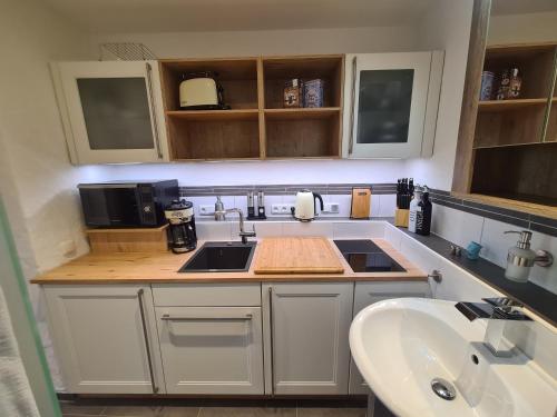 a kitchen with a sink and a counter top at Haus Waldstein Kraxler Single in Weißenstadt