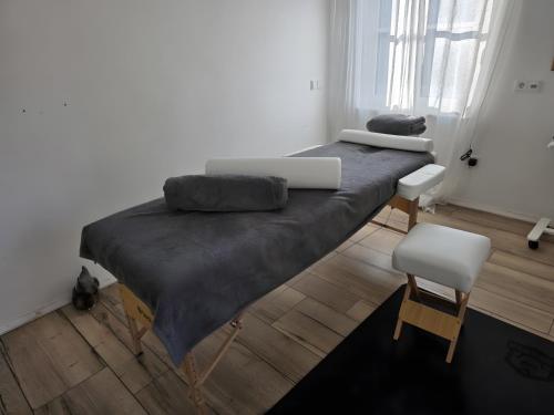 two beds in a room with a laptop on it at Haus Waldstein Kraxler Single in Weißenstadt