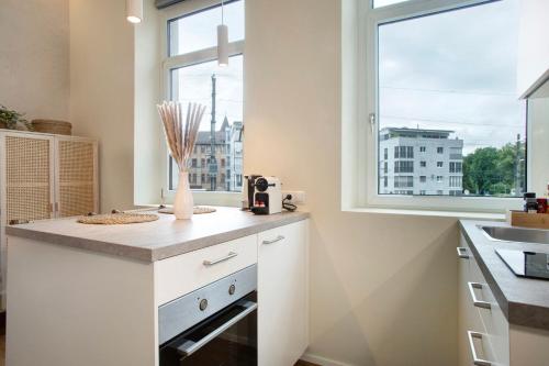 a kitchen with a counter and a window at Sonnenblick Bregenz in Bregenz
