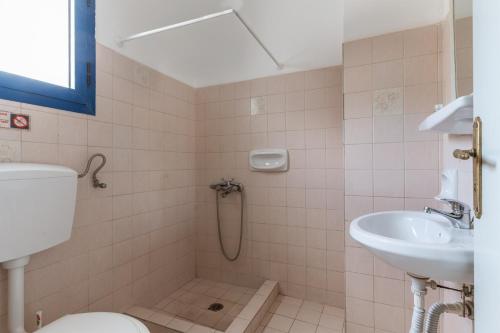 a bathroom with a shower and a sink at Perasma Studios 9 in Kipri