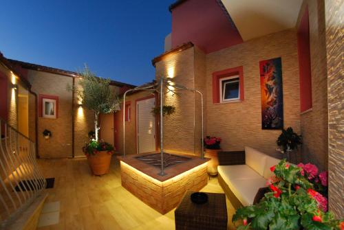 a balcony of a house with a hot tub at Smart Suite & Apartments in Santa Teresa Gallura