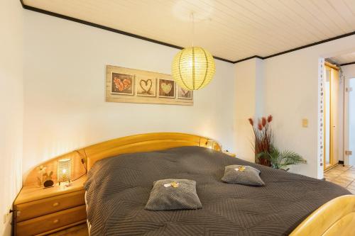 a bedroom with a bed with two pillows on it at Ferienwohnung Stork in Möhnesee