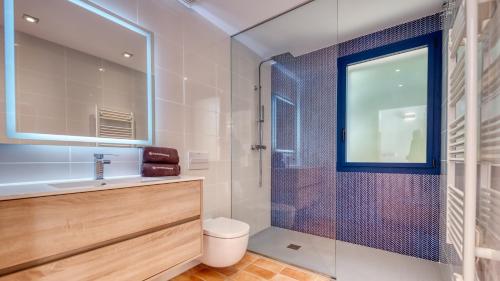 a bathroom with a shower and a toilet and a sink at Costacabana - Casa Adora in Tossa de Mar