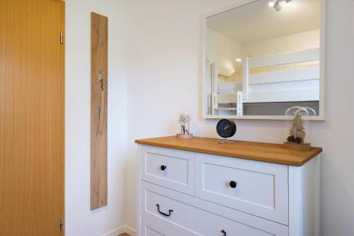 a bathroom with a sink and a mirror at Ferienwohnung Niki in Titisee-Neustadt