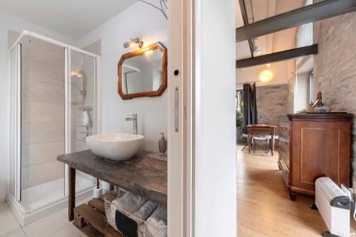 a bathroom with a sink and a mirror at Loft e Veranda sul Lago di Como in Blevio
