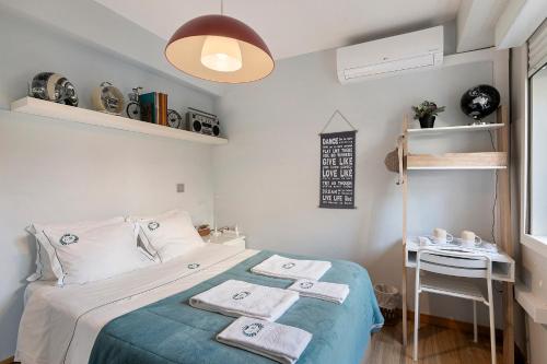 a small bedroom with a bed with towels on it at Annex Bedroom - Oporto Garden in Porto