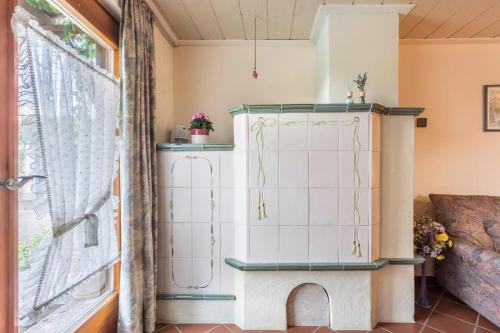 a room with a cabinet and a window at Haus Rosi und Werner in Emmerting
