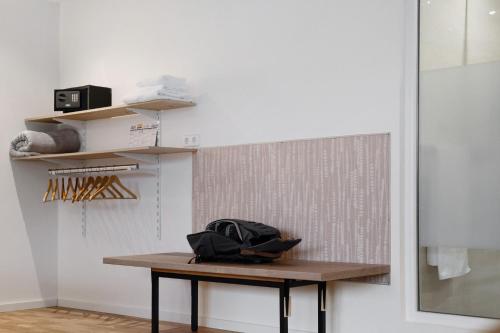 a table with a bag sitting on it in a room at Sonnige Ferienwohnung im Kinzigtal in Wolfach