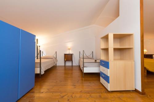 a bedroom with a bed and a desk at Il Nazareno - Civetta in Cecina