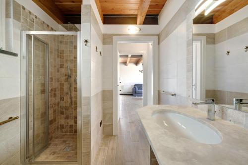 a bathroom with a sink and a shower at Villa Lice - Vigneto in Casarza Ligure