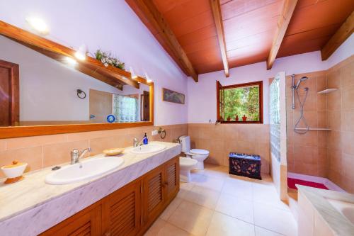 a bathroom with a sink and a toilet at Can Me Sents in Pollença