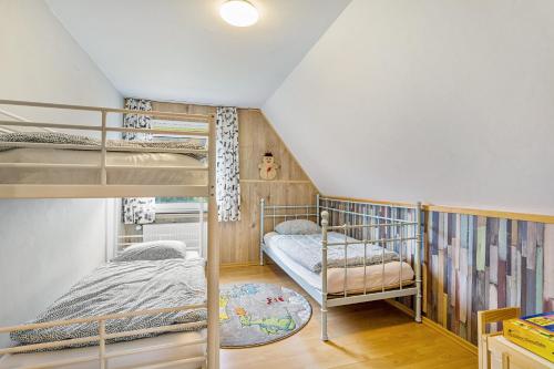 two bunk beds in a room with a attic at Yalet Ferienhaus in Brilon
