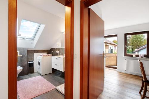 a bathroom with a sink and a toilet in a room at Ferienwohnung In Bempflingen in Bempflingen