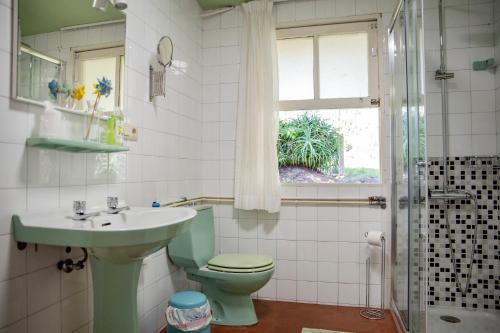 a bathroom with a sink and a toilet and a shower at Casa Con Encanto in Bueu