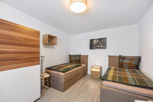 a bedroom with a bed and a couch at Radlerrast in Weißenfels