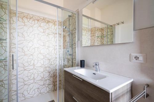 a bathroom with a sink and a shower at Casa Jerzu S'essia de su santu in Jerzu