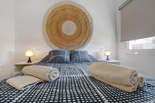 a bedroom with a bed with two pillows on it at El Cotillo Mar Sea View in El Cotillo