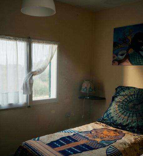 a bedroom with a bed and a window at GTE singola in Poggio