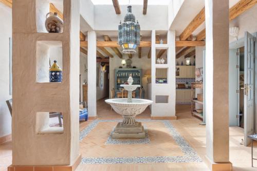 a living room with a fountain in the middle of a room at Oasis San Martin El Cotillo in El Cotillo