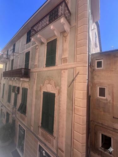 a building with a balcony on the side of it at Casa di Mà Varazze in Varazze