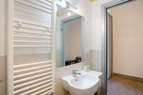 a bathroom with a sink and a mirror at Buddha, borgo dei pescatori in Cervo