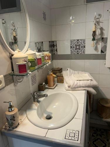 a bathroom with a sink and a mirror at Mas de Maussan in Robion en Luberon