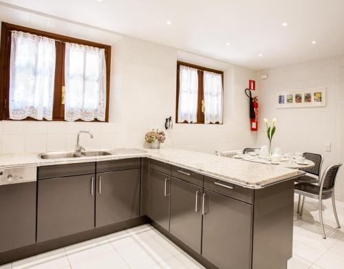 a kitchen with a sink and a counter top at Gran Castanyer in Viladrau