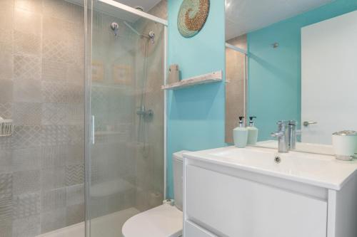 a bathroom with a shower and a sink and a toilet at Atico de Lux Zahara in Zahara de los Atunes