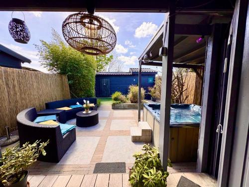 a small backyard with a swimming pool and a patio at 1001 Nights Luxury Spa Oasis with jacuzzi sauna and garden near Amsterdam in Vijfhuizen