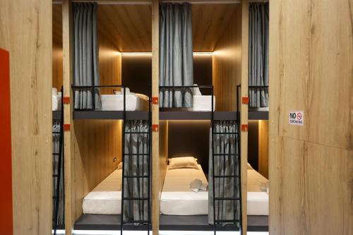 a room with three bunk beds in it at Grand Hostel Berat in Berat