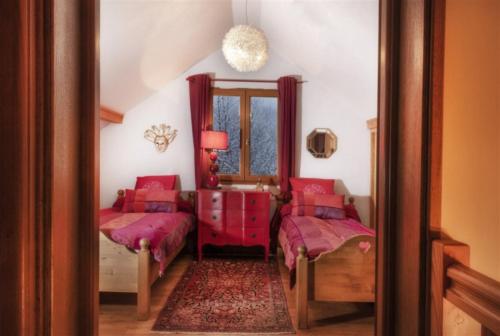 Postel nebo postele na pokoji v ubytování Chalet l'Orée du Bois