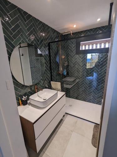 a bathroom with a toilet and a sink and a shower at U Flenu sea view in San-Martino-di-Lota