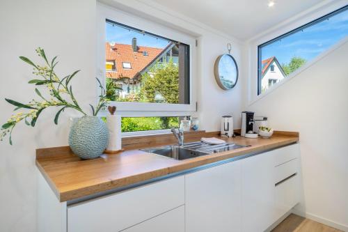 a kitchen with a sink and a window at Pfänderblick in Lindau