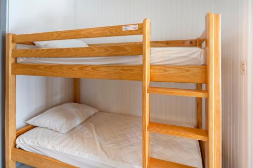 a couple of bunk beds in a room at Evasion Atlantique, accès plage in Capbreton