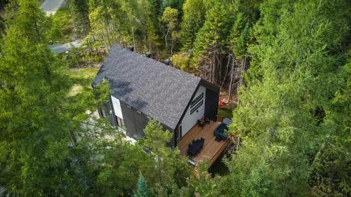 an overhead view of a house in the trees at Villa Boreale - Private Spa Pool & Foosball in Valcartier Station