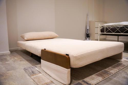 a pair of beds sitting in a room at Ferienwohnung in Pfullendorf