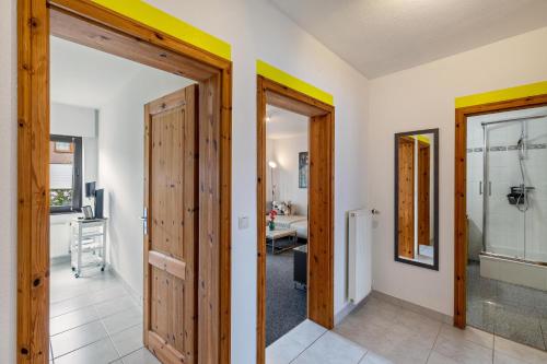 a hallway with two doors and a bathroom at Heike in Willich
