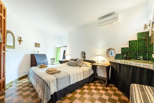 a bedroom with a bed in a room at El Palomar in Santanyi