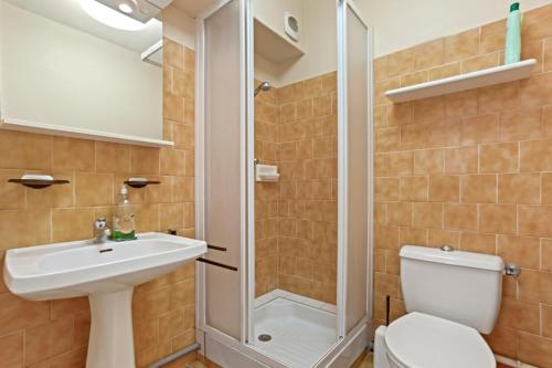 a bathroom with a shower and a toilet and a sink at Le Mas Berliat studio N° 10 in Bormes-les-Mimosas
