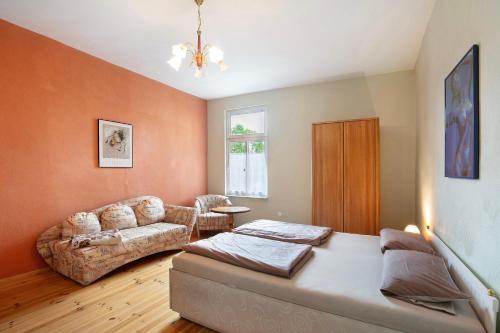 a living room with a couch and a living room at Haus Meistereck Melzow in Melzow