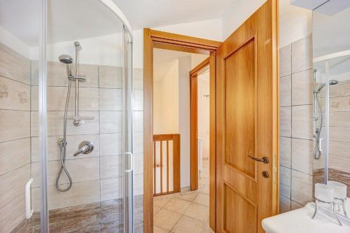 a bathroom with a shower and a toilet and a sink at Casa Paola e del Poeta in Costa Carnara